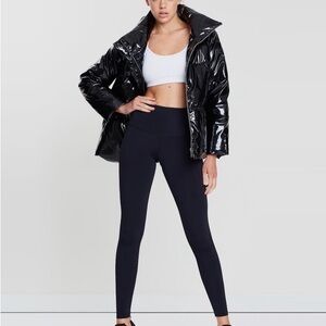 Stay dry and warm in this Shiny Black Puffer Jacket